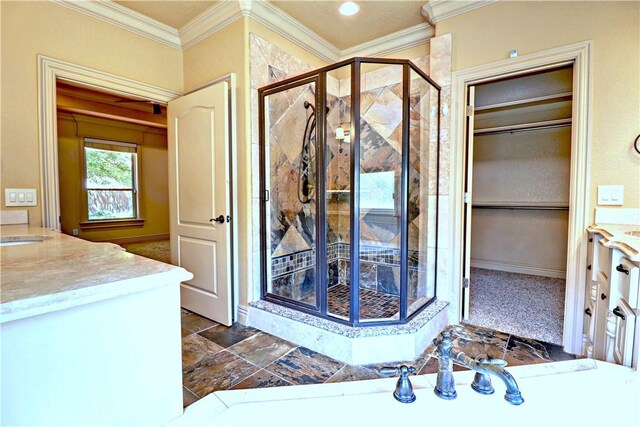 full bathroom featuring a stall shower, vanity, and crown molding