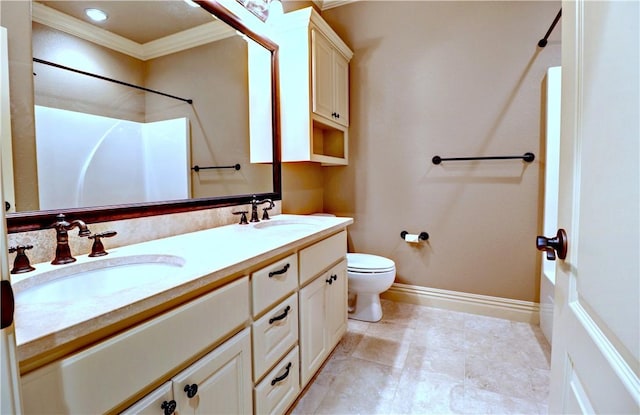 full bathroom with double vanity, toilet, ornamental molding, and a sink