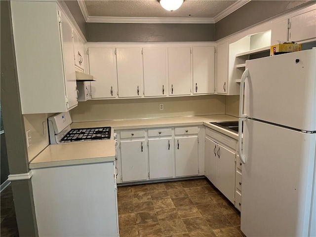 kitchen featuring freestanding refrigerator, range with gas stovetop, under cabinet range hood, light countertops, and ornamental molding