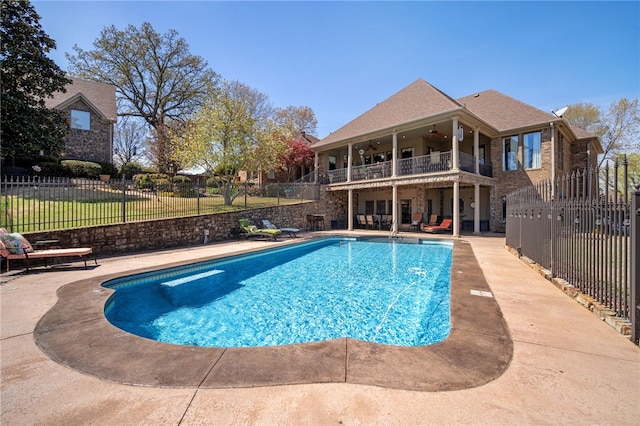 view of swimming pool featuring a fenced backyard, ceiling fan, a patio, and a fenced in pool