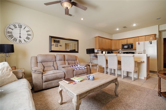 living area featuring light tile patterned floors, visible vents, a ceiling fan, and recessed lighting