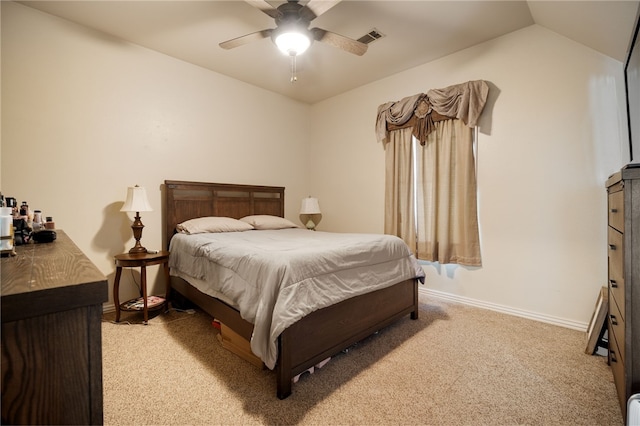 bedroom with lofted ceiling, light colored carpet, visible vents, ceiling fan, and baseboards