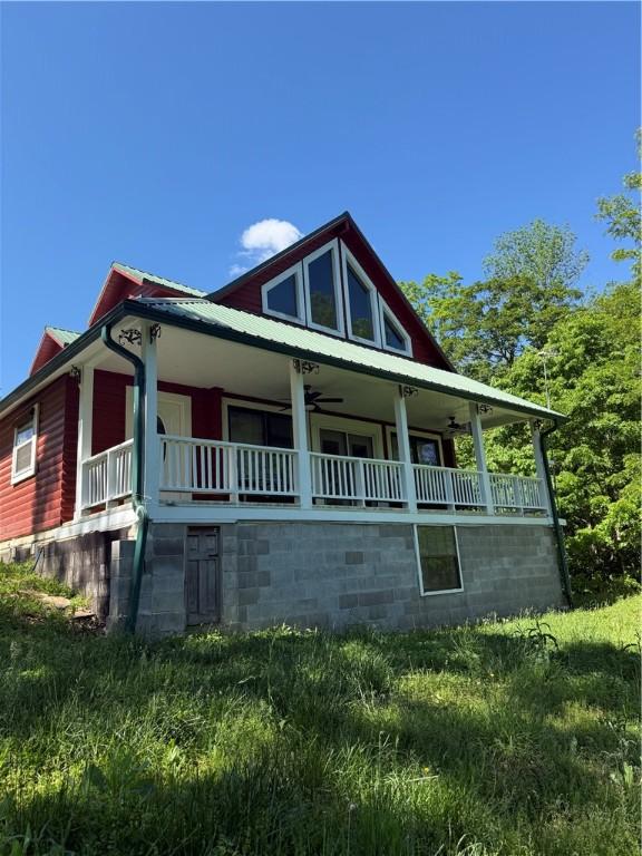 2132 County Road 246, Berryville, AR 72616 - farmhouse-style home featuring a porch and ceiling fan