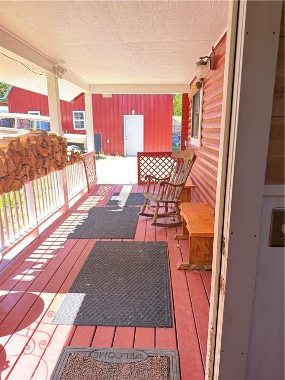 2132 County Road 246, Berryville, AR 72616 - wooden deck with a porch