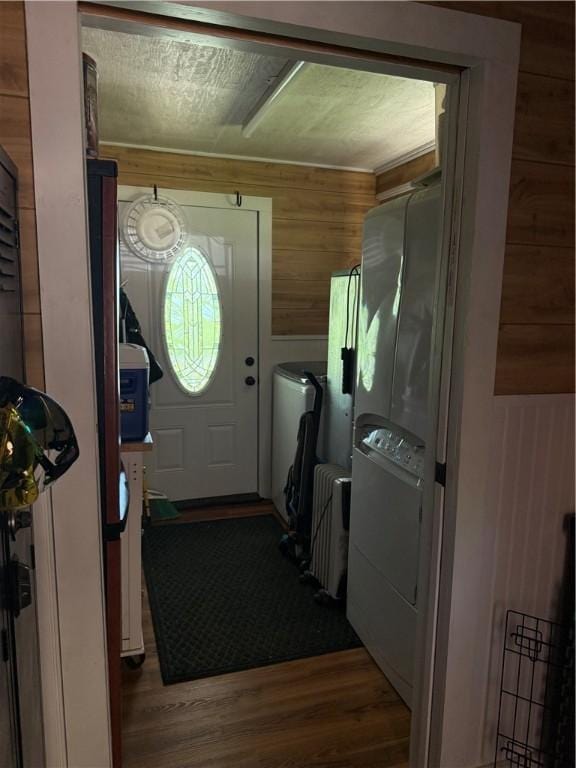 2132 County Road 246, Berryville, AR 72616 - clothes washing area featuring laundry area, wood walls, independent washer and dryer, and dark wood finished floors