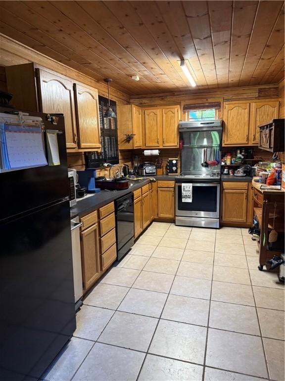 2132 County Road 246, Berryville, AR 72616 - kitchen with wooden ceiling, light tile patterned floors, brown cabinets, black appliances, and dark countertops
