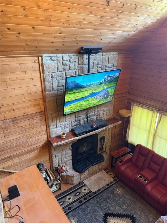 2132 County Road 246, Berryville, AR 72616 - living area with lofted ceiling, a wood stove, wood walls, and wooden ceiling