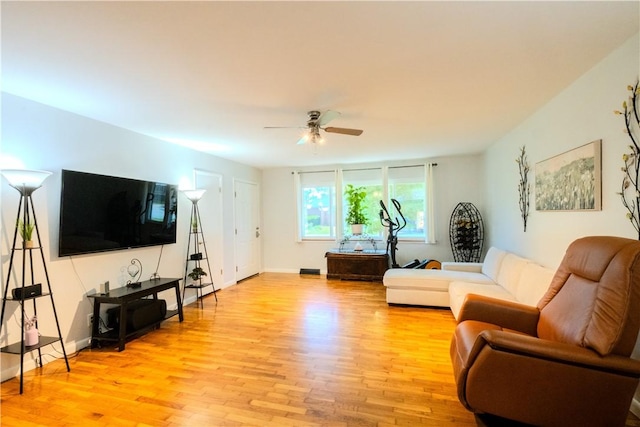 314 Crestview Dr, Bentonville, AR 72712 - living room with light wood finished floors, ceiling fan, and baseboards
