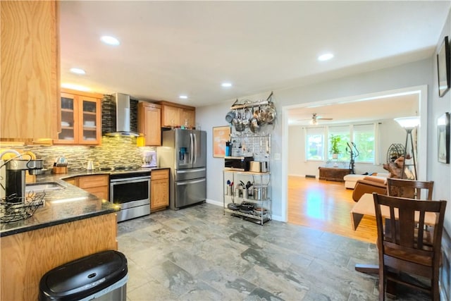 314 Crestview Dr, Bentonville, AR 72712 - kitchen with wall chimney range hood, appliances with stainless steel finishes, tasteful backsplash, a sink, and recessed lighting