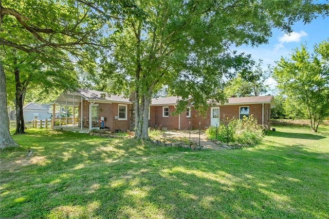 101 Carter Ln, Elkins, AR 72727 - rear view of property with a lawn and brick siding