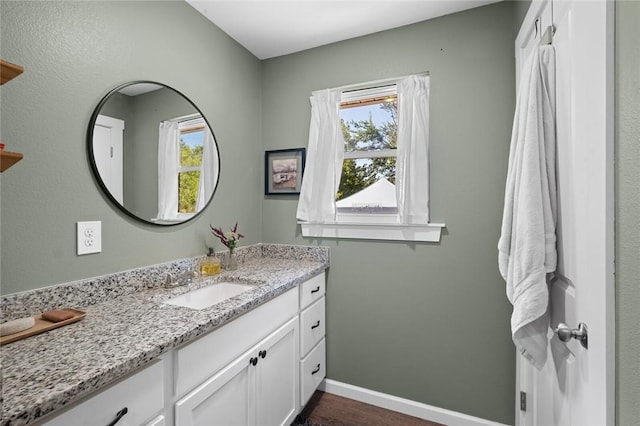 101 Carter Ln, Elkins, AR 72727 - bathroom featuring baseboards, vanity, and wood finished floors