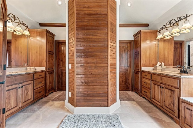 full bathroom featuring a sink, ornamental molding, two vanities, and recessed lighting