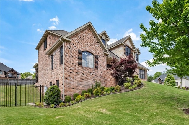 view of home's exterior with brick siding
