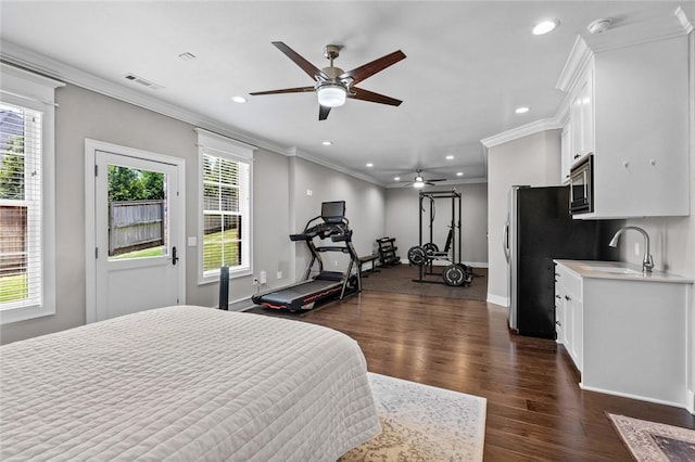 bedroom with crown molding, recessed lighting, baseboards, dark wood-type flooring, and a sink
