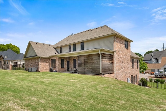 back of property with cooling unit, brick siding, and a shingled roof