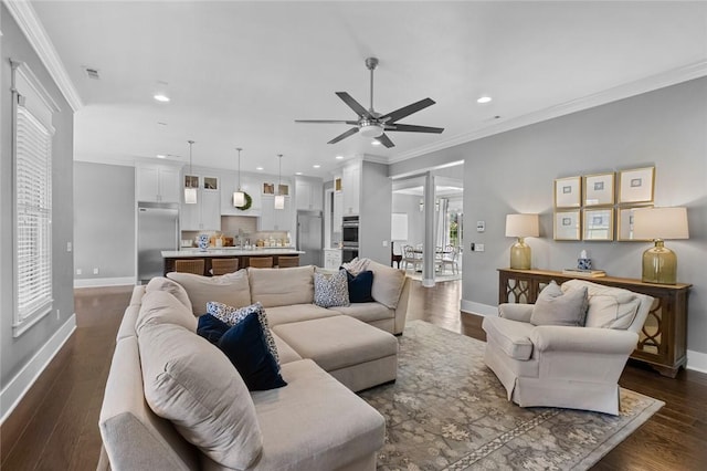 living room featuring recessed lighting, baseboards, ceiling fan, ornamental molding, and dark wood-type flooring