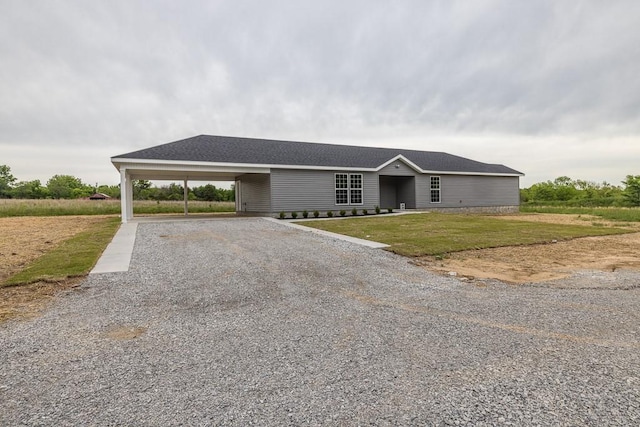 190 Madison Unit 6124, Elkins, AR 72727 - single story home featuring gravel driveway, a front yard, and an attached carport