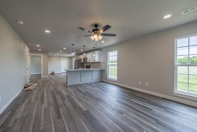 190 Madison Unit 6124, Elkins, AR 72727 - kitchen with stainless steel appliances, recessed lighting, open floor plan, baseboards, and dark wood-style flooring