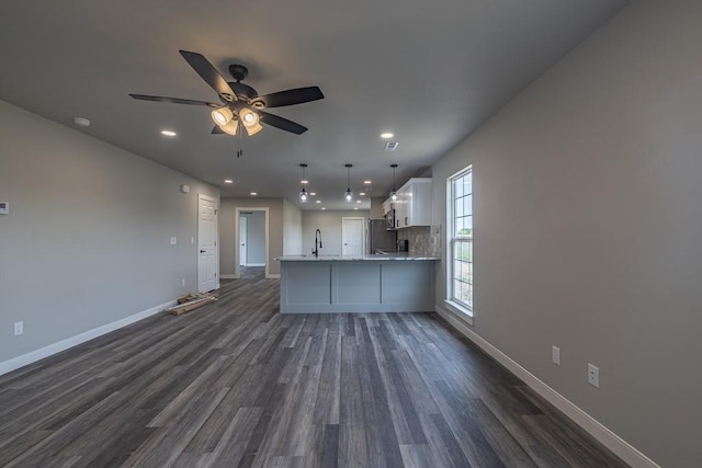 190 Madison Unit 6124, Elkins, AR 72727 - unfurnished living room with a sink, recessed lighting, dark wood-type flooring, and baseboards