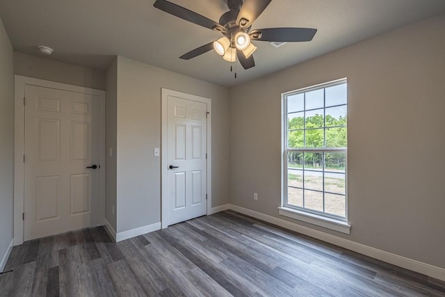 190 Madison Unit 6124, Elkins, AR 72727 - unfurnished bedroom featuring baseboards, wood finished floors, and a ceiling fan