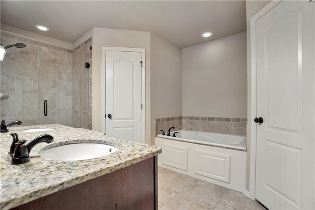 bathroom featuring a shower stall, a garden tub, vanity, tile patterned flooring, and recessed lighting