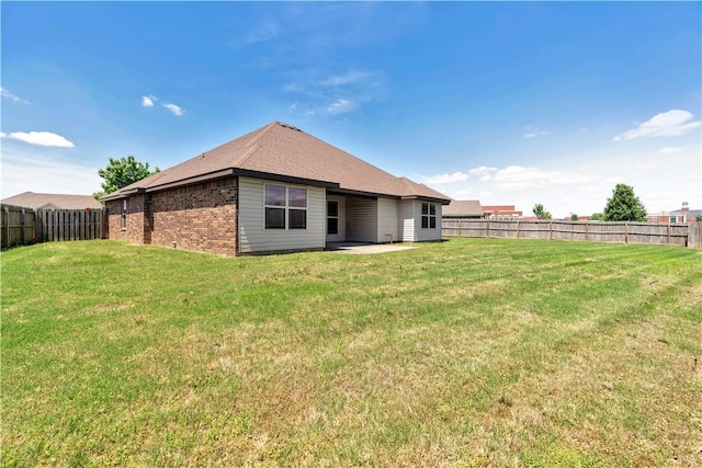 back of house with brick siding and a patio area