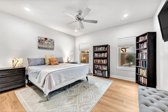 2227 Riggins Ave, Pea Ridge, AR 72751 - bedroom with wood finished floors, baseboards, a ceiling fan, and recessed lighting