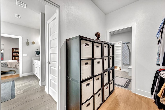 2227 Riggins Ave, Pea Ridge, AR 72751 - corridor featuring light wood-type flooring and baseboards
