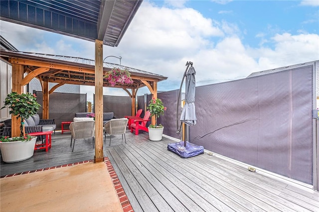 2227 Riggins Ave, Pea Ridge, AR 72751 - wooden deck featuring a gazebo, fence, and outdoor dining area