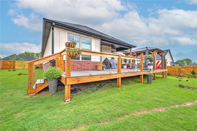 2227 Riggins Ave, Pea Ridge, AR 72751 - back of house featuring a wooden deck and board and batten siding