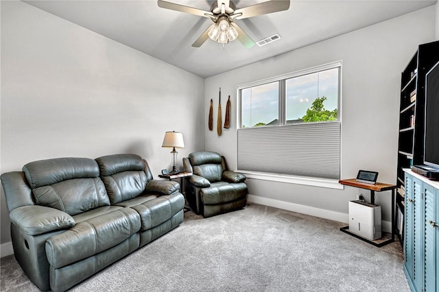 2227 Riggins Ave, Pea Ridge, AR 72751 - carpeted living area featuring ceiling fan and baseboards