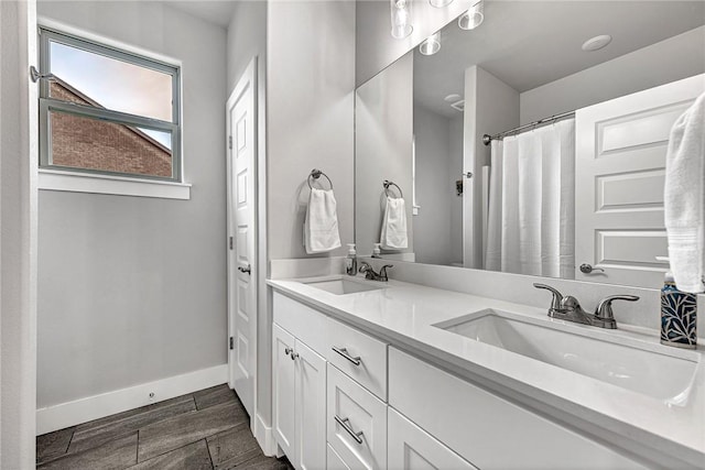 2227 Riggins Ave, Pea Ridge, AR 72751 - bathroom with baseboards and double vanity