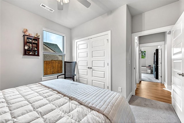 2227 Riggins Ave, Pea Ridge, AR 72751 - bedroom with carpet flooring, multiple windows, a closet, and ceiling fan
