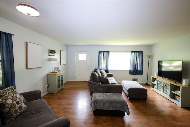 910 Sunset Ln, Harrison, AR 72601 - living area featuring healthy amount of natural light, hardwood / wood-style flooring, and baseboards
