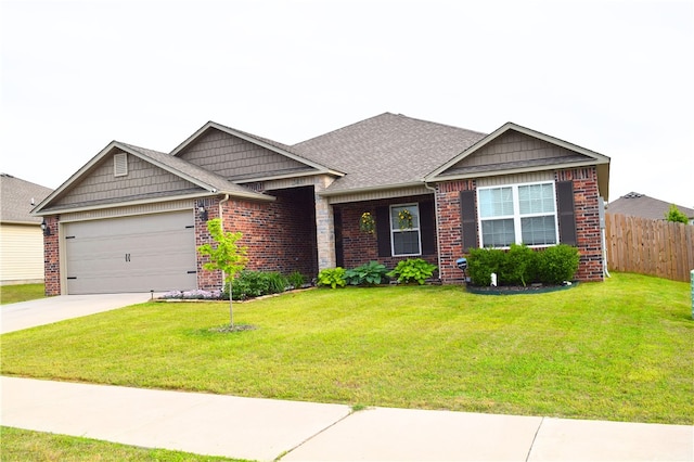 craftsman-style home featuring brick siding, an attached garage, driveway, and roof with shingles