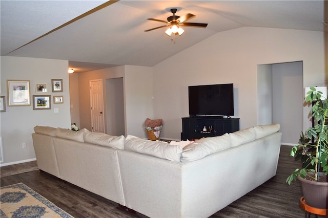 living room with ceiling fan, dark wood-style floors, vaulted ceiling, and baseboards