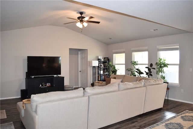 living area with dark wood-style flooring, ceiling fan, lofted ceiling, and baseboards