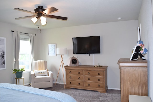 carpeted bedroom with baseboards and a ceiling fan