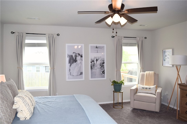 bedroom featuring carpet flooring, baseboards, and a ceiling fan
