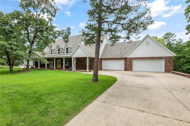 15533 Haynes Rd, Rogers, AR 72756 - new england style home with driveway, a front yard, brick siding, and a garage