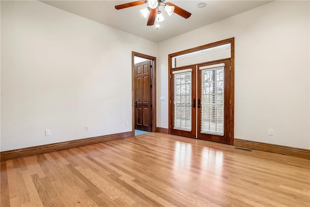 15533 Haynes Rd, Rogers, AR 72756 - unfurnished room with french doors, light wood-style floors, and baseboards