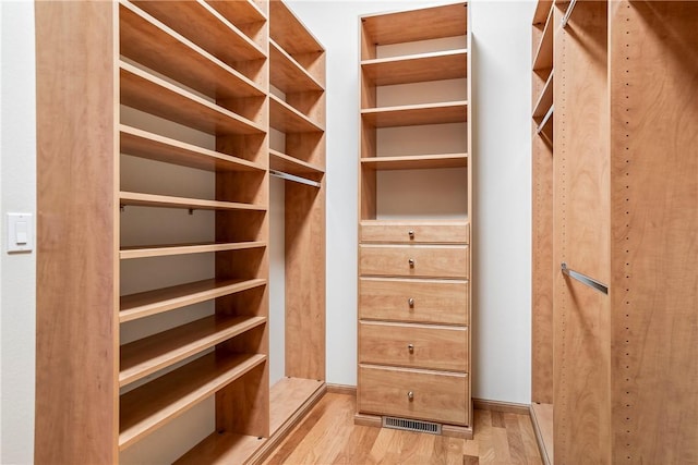 15533 Haynes Rd, Rogers, AR 72756 - spacious closet featuring light wood finished floors
