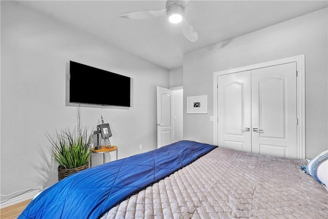 bedroom featuring a closet, a ceiling fan, and wood finished floors