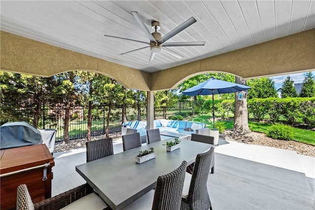 view of patio with a fenced backyard, ceiling fan, outdoor dining area, and grilling area