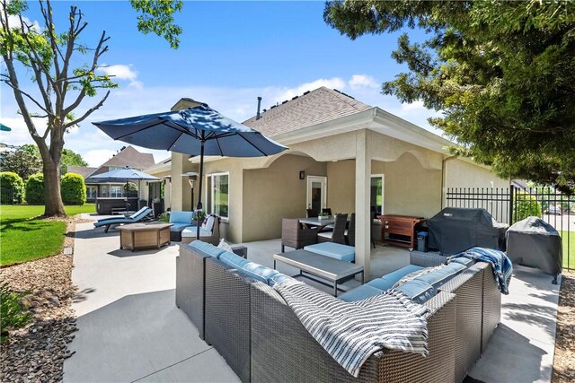 view of patio / terrace featuring outdoor lounge area, fence, and area for grilling