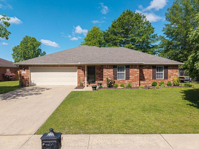 ranch-style house with an attached garage, concrete driveway, a front yard, and brick siding