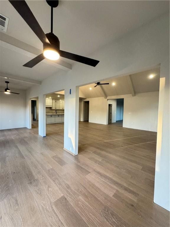502 Concord St, Lowell, AR 72745 - unfurnished living room featuring ceiling fan, wood finished floors, and a sink