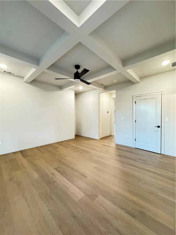 502 Concord St, Lowell, AR 72745 - spare room with coffered ceiling, light wood-style flooring, beamed ceiling, ceiling fan, and recessed lighting