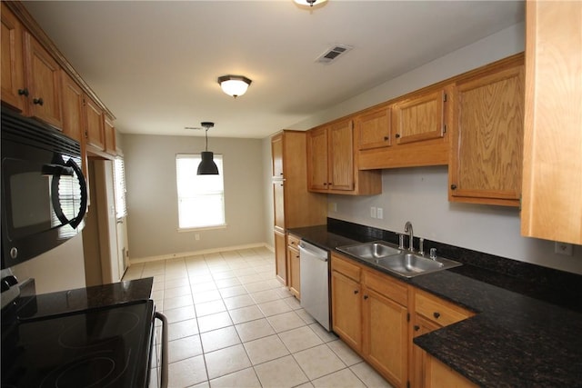 kitchen featuring black appliances, a sink, decorative light fixtures, light tile patterned floors, and brown cabinets