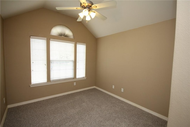 unfurnished room with lofted ceiling, a ceiling fan, carpet floors, and baseboards